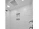 Modern shower with wave patterned tile and built-in shelves at 2292 Austrian Ln # 34, Clearwater, FL 33763