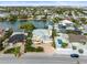 Aerial view of waterfront home with pool and private dock; desirable location at 231 21St Ave, St Pete Beach, FL 33706