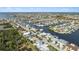 Aerial view of a neighborhood with waterfront properties and a tranquil waterway at 4148 Rudder Way, New Port Richey, FL 34652