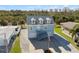 Close-up aerial view of a charming light-blue home with a two-car garage at 4148 Rudder Way, New Port Richey, FL 34652