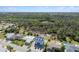 An aerial view of a home situated near a pond and lush conservation area at 4148 Rudder Way, New Port Richey, FL 34652