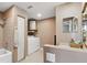 Clean bathroom with a shower/tub combo and laundry area at 4148 Rudder Way, New Port Richey, FL 34652