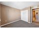 Cozy bedroom with carpet flooring and double door closet at 4148 Rudder Way, New Port Richey, FL 34652