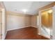 Simple bedroom with wood flooring and access to a hallway at 4148 Rudder Way, New Port Richey, FL 34652