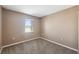 Spacious bedroom with carpeted floors and a window with natural light at 4148 Rudder Way, New Port Richey, FL 34652