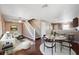 Open living room with hardwood floors, dining area, and view of kitchen at 4148 Rudder Way, New Port Richey, FL 34652