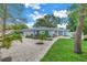 Light blue house with white trim and landscaping at 4373 Trout Se Dr, St Petersburg, FL 33705