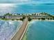 Aerial view of a coastal highway and beach at 4799 Klosterman Oaks Blvd, Palm Harbor, FL 34683