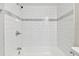 Clean bathroom with white subway tile and a bathtub at 503 Avocado Cir, Brandon, FL 33510