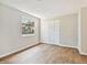 Spacious bedroom with wood-look tile floors and window at 503 Avocado Cir, Brandon, FL 33510