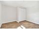 Spacious bedroom with wood-look tile floors and built-in closet at 503 Avocado Cir, Brandon, FL 33510