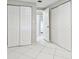 Hallway with white closet doors and tile floors at 503 Avocado Cir, Brandon, FL 33510