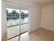 Living room with sliding doors opening to a patio overlooking a canal at 5503 67Th N Ave # 17, Pinellas Park, FL 33781