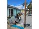 Exterior backyard view with a concrete patio and various outdoor items at 610 78Th Ave, St Pete Beach, FL 33706
