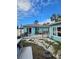 View of backyard showing patio, landscaping, and storage at 610 78Th Ave, St Pete Beach, FL 33706