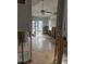 Renovation needed kitchen with tiled floor and exposed ceiling beams at 610 78Th Ave, St Pete Beach, FL 33706