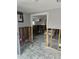 Damaged kitchen needing renovation, with tiled floor at 610 78Th Ave, St Pete Beach, FL 33706