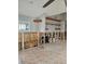 Spacious living room featuring exposed framing and tile flooring, ready for renovation at 610 78Th Ave, St Pete Beach, FL 33706
