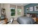 Bright bedroom featuring a comfortable bed and built-in workspace at 721 Sky Shade Dr, Apollo Beach, FL 33572