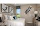 Cozy bedroom with a queen-sized bed and large window at 721 Sky Shade Dr, Apollo Beach, FL 33572