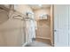 Large walk-in closet with custom shelving and hanging rods at 721 Sky Shade Dr, Apollo Beach, FL 33572