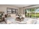 Kitchen and dining area with white cabinets and a large wooden dining table at 721 Sky Shade Dr, Apollo Beach, FL 33572