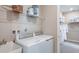Laundry room with washer, dryer, and additional storage at 721 Sky Shade Dr, Apollo Beach, FL 33572