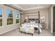 Main bedroom with a four poster bed, neutral decor and plenty of natural light at 721 Sky Shade Dr, Apollo Beach, FL 33572