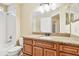 Bathroom with granite countertop, wood cabinets, and a shower/tub combo at 816 Cape Cod Cir, Valrico, FL 33594