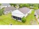 Aerial view of home featuring a well-maintained lawn and screened in back porch at 10543 Opus Dr, Riverview, FL 33579