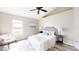 Comfortable bedroom with a vaulted ceiling and bright window at 10543 Opus Dr, Riverview, FL 33579