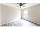 Comfortable bedroom featuring a ceiling fan and a bright window at 10543 Opus Dr, Riverview, FL 33579