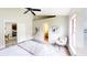 Bright bedroom with vaulted ceiling, a comfortable bed, wood floors, and lots of sunlight at 10543 Opus Dr, Riverview, FL 33579