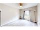 Cozy bedroom featuring wood floors, a large window, and ample space for furniture at 10543 Opus Dr, Riverview, FL 33579