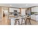 Open kitchen with granite countertops, island with seating, and stainless steel appliances at 1256 Maritime Hammock Ave, Ruskin, FL 33570