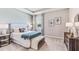 Bright bedroom with patterned headboard, bench, and wood dresser at 16026 10Th E Ave, Bradenton, FL 34212