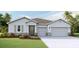 Inviting home with a manicured lawn, stone accents, and a convenient two-car garage at 16026 10Th E Ave, Bradenton, FL 34212