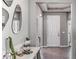 Inviting hallway featuring modern decor, sleek mirrors, and neutral paint at 16026 10Th E Ave, Bradenton, FL 34212