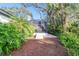 Screened patio surrounded by lush landscaping at 1903 Gulf Beach Blvd, Tarpon Springs, FL 34689