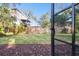 Landscaped backyard with privacy fence and lush greenery at 1903 Gulf Beach Blvd, Tarpon Springs, FL 34689