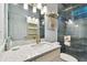 Modern bathroom with a walk-in shower and updated vanity at 1903 Gulf Beach Blvd, Tarpon Springs, FL 34689