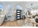 Light and airy entryway with hardwood floors and a view of the living area at 1903 Gulf Beach Blvd, Tarpon Springs, FL 34689