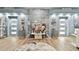 Serene entryway with unique artwork, decorative accents, and light blue walls at 1903 Gulf Beach Blvd, Tarpon Springs, FL 34689