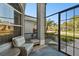 Relaxing screened porch with comfy seating at 1903 Gulf Beach Blvd, Tarpon Springs, FL 34689