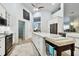 Spacious kitchen with large island, white cabinetry, and granite countertops at 1903 Gulf Beach Blvd, Tarpon Springs, FL 34689