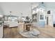 Open concept living area with hardwood floors and a neutral color palette at 1903 Gulf Beach Blvd, Tarpon Springs, FL 34689