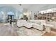 Spacious living room with large sectional sofa and hardwood floors at 1903 Gulf Beach Blvd, Tarpon Springs, FL 34689