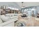 Bright living room with calming decor, built-in shelving, and a cozy seating area at 1903 Gulf Beach Blvd, Tarpon Springs, FL 34689