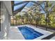 Inviting, refreshing, and private screened pool at 1903 Gulf Beach Blvd, Tarpon Springs, FL 34689