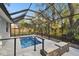 Private screened pool with ample deck space for lounging at 1903 Gulf Beach Blvd, Tarpon Springs, FL 34689